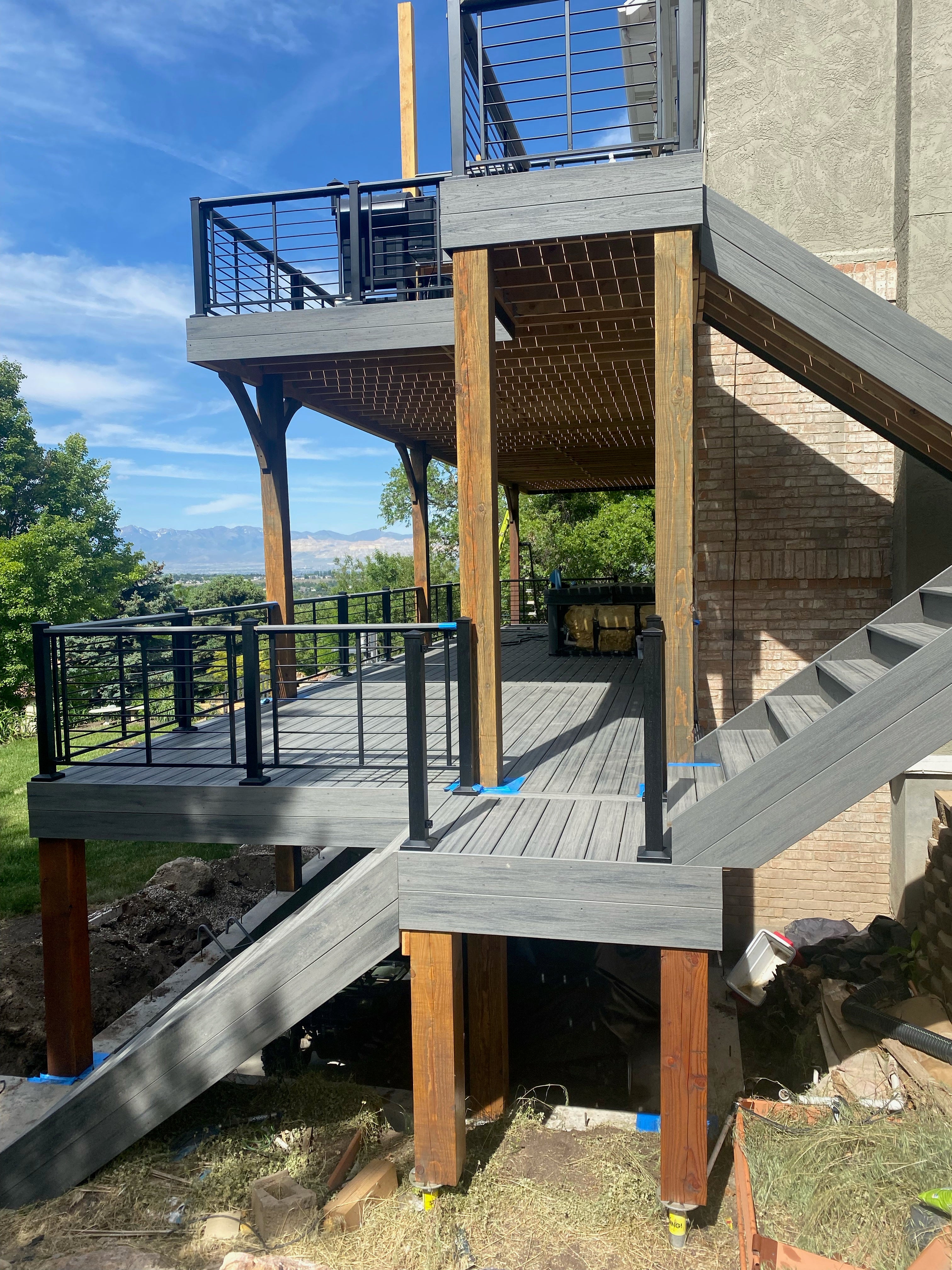 gray island mist trex decking 2 story with modern cable railing