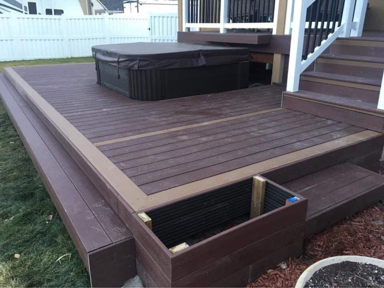trex_decking_built_around_hottub_white_and_black_vinyl_handrail